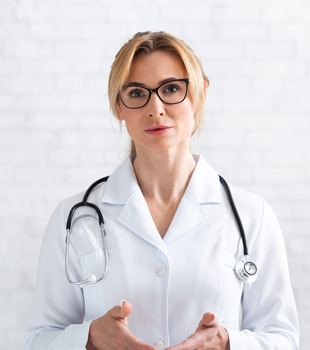 Woman doctor with stethoscope around her neck looking forward with hands out